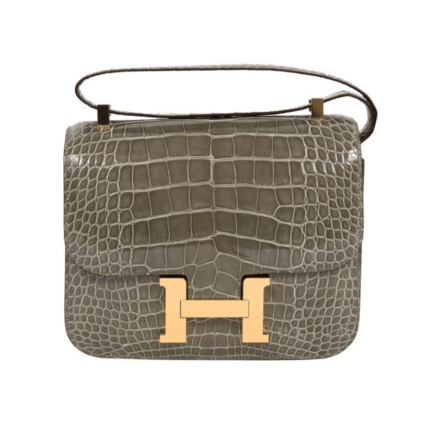 Hermès | Constance 18  Gris Tourterelle shiny alligator leather with gold hardware.